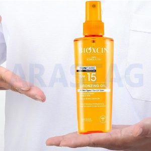 روغن آفتاب برنزه کننده بیوکسین حاوی SPF15 مناسب انواع پوست ۲۰۰ میلی