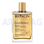 اسپری روغن صورت بدن و مو بیوکسین BIOXCIN مدل GOLD ON SKIN حجم 100 میلی